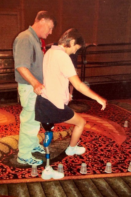 Diane learning some balance drills at the Amputee Coalition of America's annual conference in Boston, 2003.