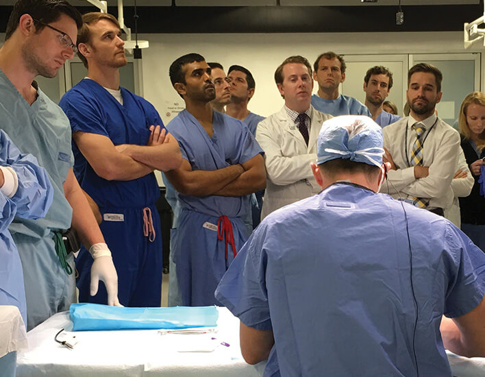 residency students observing doctor in hospital