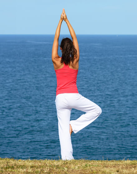 woman doing yoga pose outside