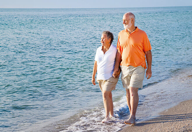 Couple walking along the beach