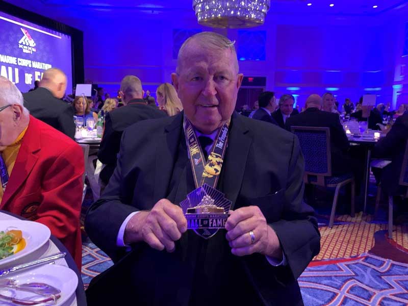 Colonel Ron Rook showing off medal