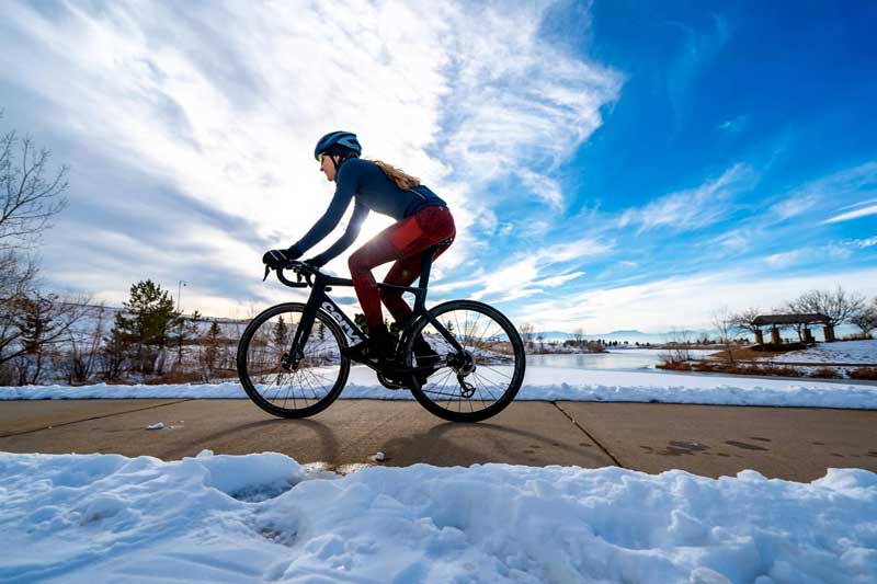 woman biking in the snow