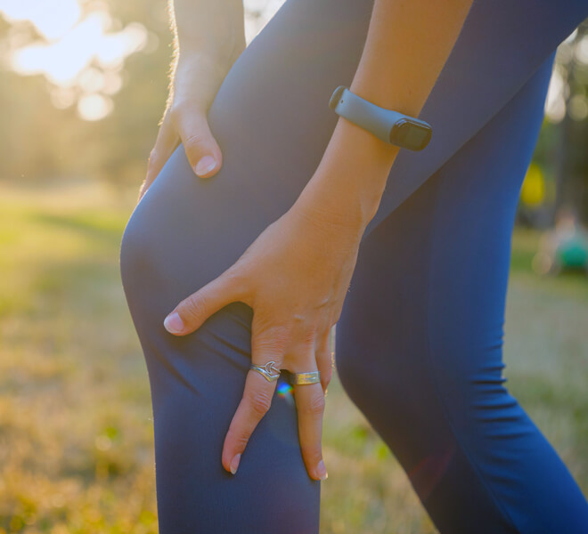 close up of person clutching knee