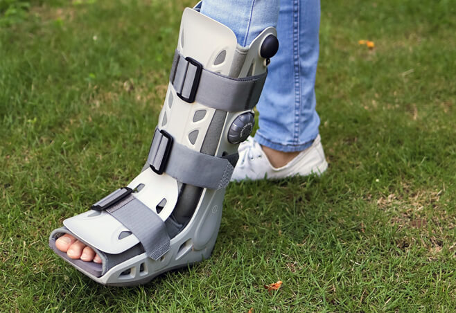 Patient in a boot after an intraarticular calcaneal fracture