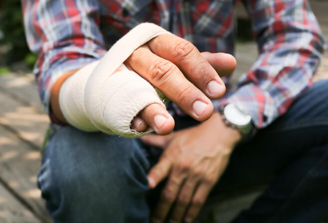 Man with cast after finger replantation