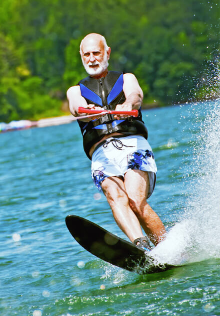 elderly man waterskiing