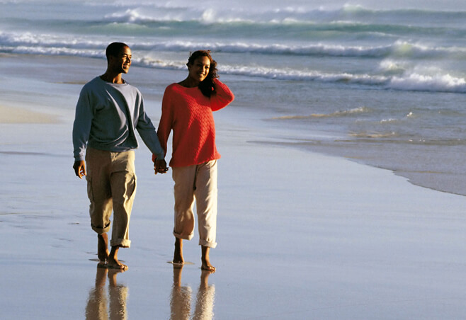 Couple walking on the beach