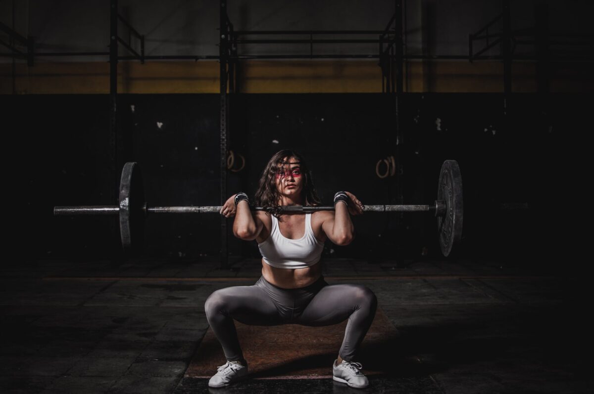 female athlete bench press squat