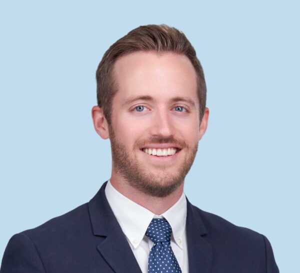 Brooks R. Osburn, MD professional headshot wearing black suit with blue polka dot tie