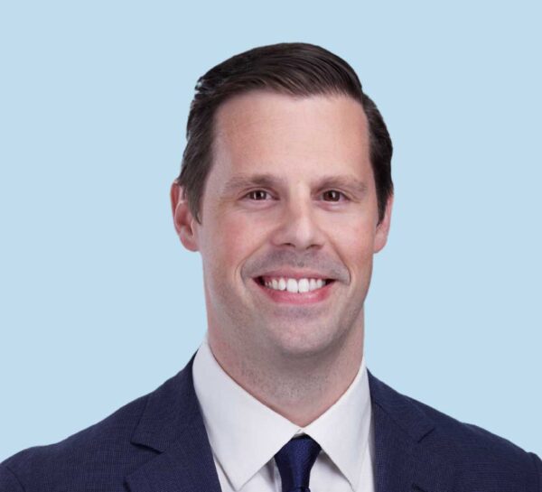 David M. Donohue, MD professional headshot wearing deep blue suit with navy tie