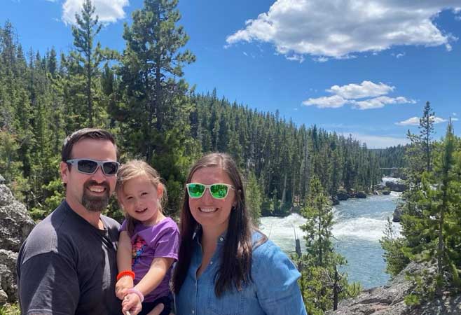 Dr. Devin Collins with his family in a scenic view