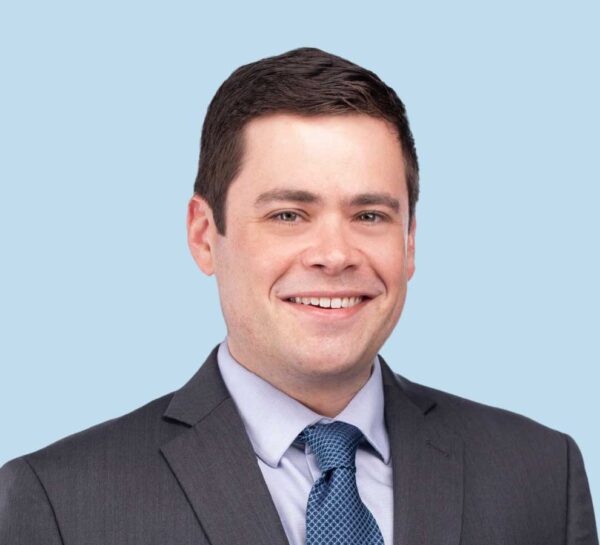 Evan M. Loewy, MD professional headshot wearing gray suit with blue tie