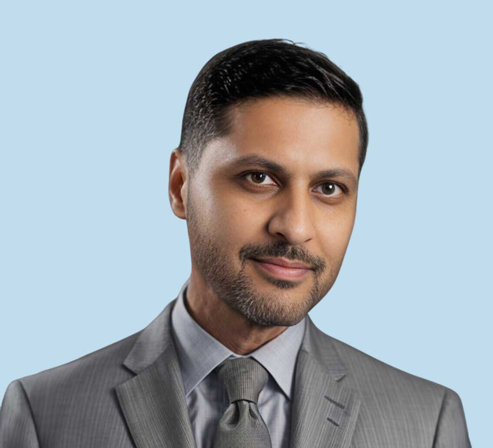 Hassan R. Mir, MD professional headshot wearing dark gray suit