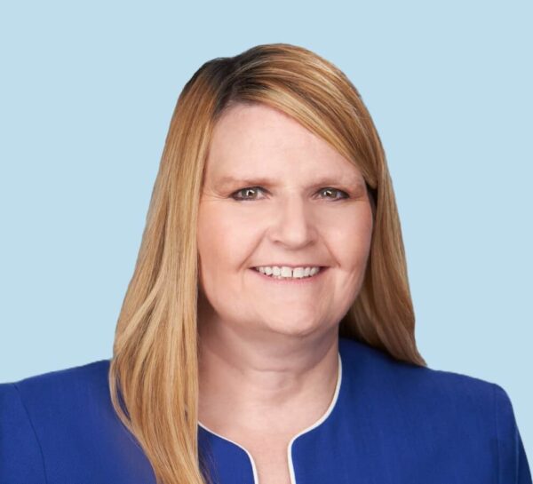 Karen A. Derr, DC professional headshot wearing blue suit jacket with white trim