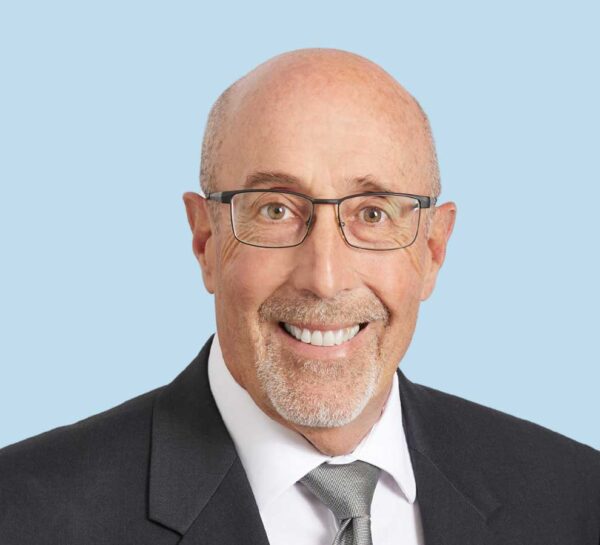 Michael Werner professional headshot wearing black suit and grey tie