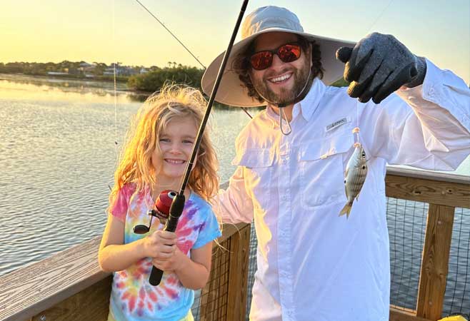 Dr. Peter Howard fishing with daughter clearwater beach