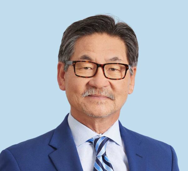 Sang Choi, MD professional headshot wearing blue suit with striped tie