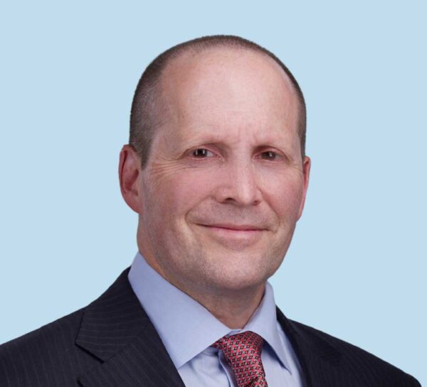 Seth I. Gasser, MD professional headshot wearing black suit with red patterned tie