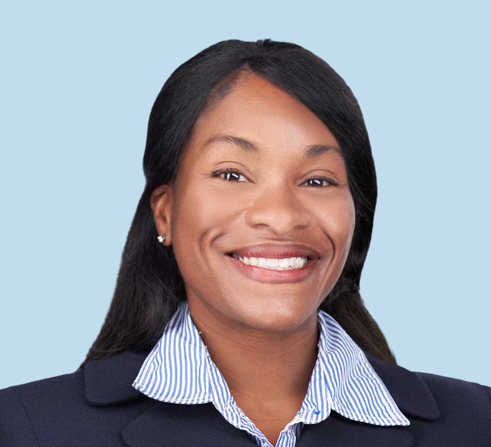 Stephanie J. Epting, DO professional headshot wearing black suit jacket and striped blouse