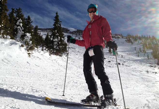 Dr. Tara Sonnanstine skiing on a snow covered mountain