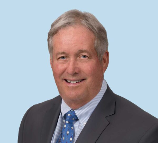 Thomas Schwab, MD professional headshot wearing dark gray suit with blue tie