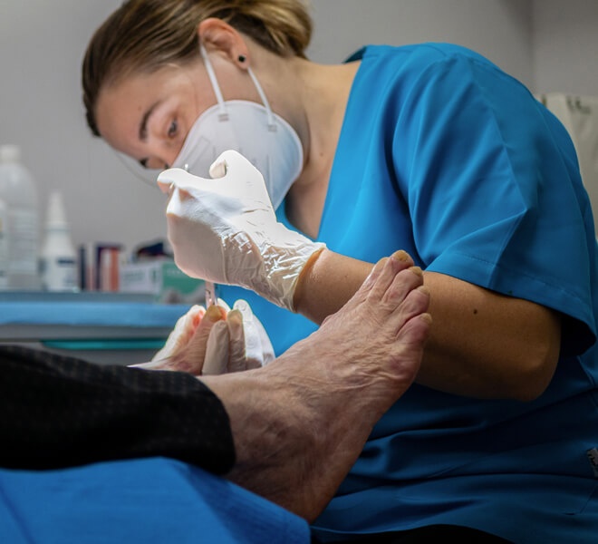 Podiatrist doctor performing medical exam on patient