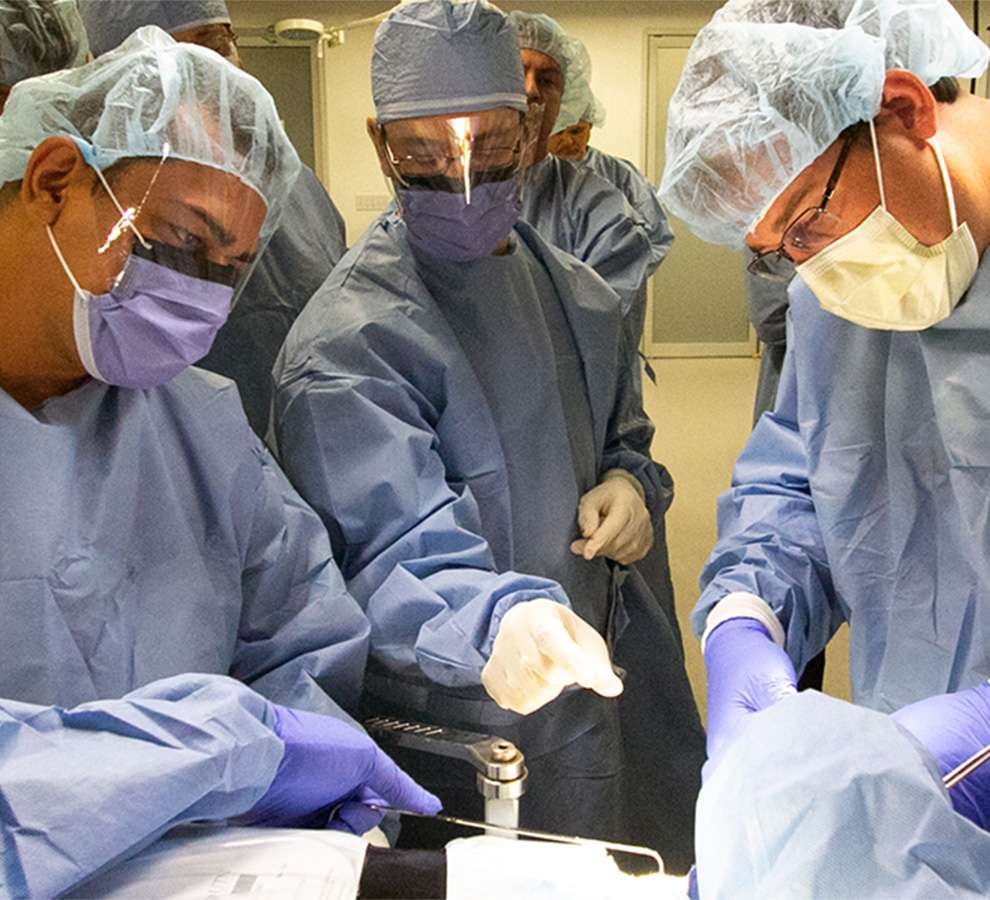 team of Orthopedic physicians performing operation for research