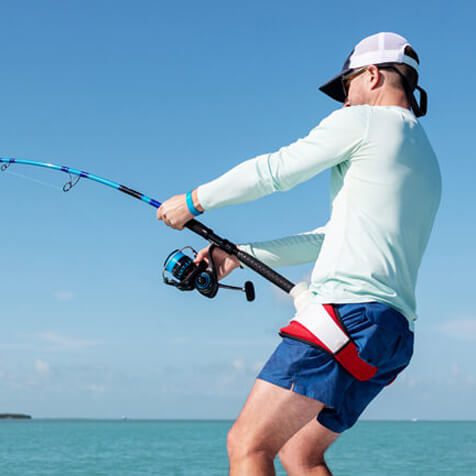 Fisherman reeling in a large catch