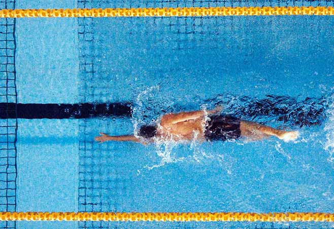 Man swimming laps in a pool