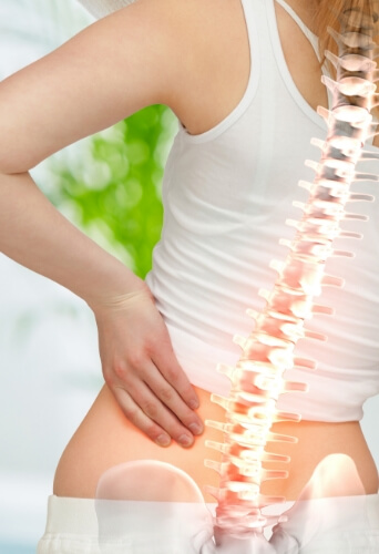 woman holding hip with indication of where bones are